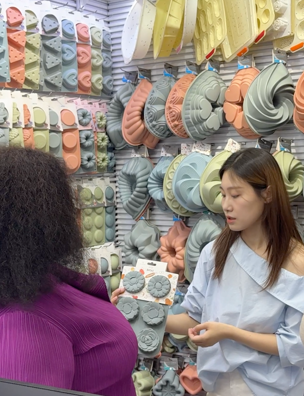 Kezon team discussing silicone products in the showroom
